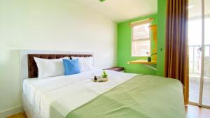 Good and Homey Studio at Belmont Residence Puri Apartment By Travelio