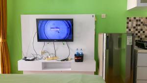 Good and Homey Studio at Belmont Residence Puri Apartment By Travelio