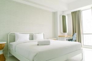 Cozy and Spacious 2BR The Mansion Kemayoran Apartment near JIEXPO By Travelio