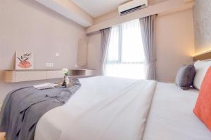 Good Place and Spacious 3BR Sky House BSD Apartment By Travelio