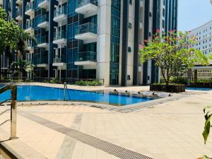 Two Palm Tree Villas Condominium - Studio 1O with Balcony - Across Terminal 3 Airport