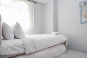 Nice and Cozy Living 2BR at Green Pramuka City Apartment By Travelio