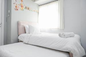 Nice and Cozy Living 2BR at Green Pramuka City Apartment By Travelio