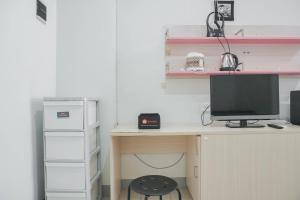 Nice and Cozy Living 2BR at Green Pramuka City Apartment By Travelio