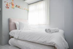 Nice and Cozy Living 2BR at Green Pramuka City Apartment By Travelio