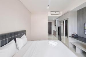 Homey and Scenic Studio at Patraland Amarta Apartment By Travelio