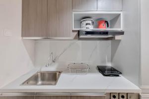 Homey and Scenic Studio at Patraland Amarta Apartment By Travelio