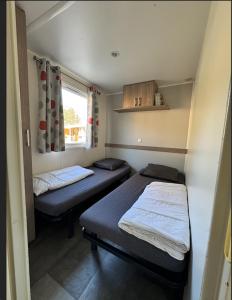 Campings Grand MobilHome 6 Places Climatise : photos des chambres