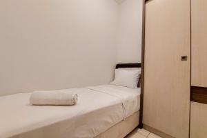 Cozy Living and Tidy 2BR Serpong Greenview Apartment By Travelio