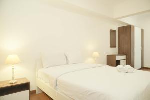 Good Place 2BR Apartment at Sudirman Tower Condominium By Travelio