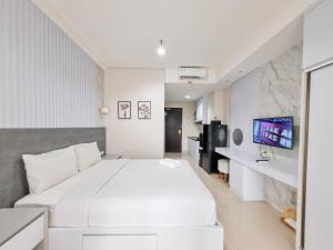 Good and Cozy Studio at Patraland Amarta Apartment By Travelio