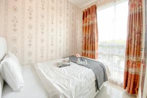 Strategic and Comfort Stay 2BR Apartment Woodland Park Residence By Travelio