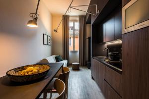 Eco Chic room with sofa bed and kitchen by Design Club Collection