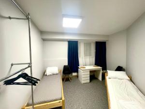 Single Room with Shared Shower and Toilet room in Central Hostel Jelgava