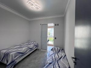 Ap Riviera pé na areia com vista