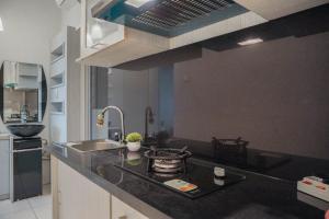 Warm and Homey 1BR at Teluk Intan Apartment By Travelio