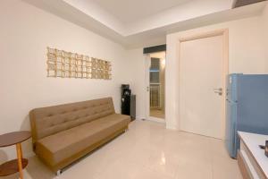 1BR with Direct Access to Pool at Parahyangan Residence Apartment By Travelio