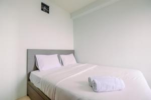 Combined 2BR with Study Room Titanium Square Apartment By Travelio
