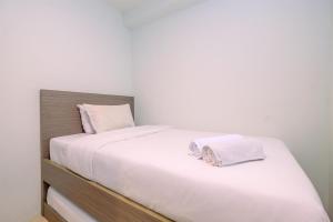 Combined 2BR with Study Room Titanium Square Apartment By Travelio