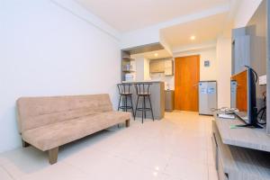 Combined 2BR with Study Room Titanium Square Apartment By Travelio