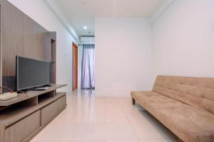 Combined 2BR with Study Room Titanium Square Apartment By Travelio
