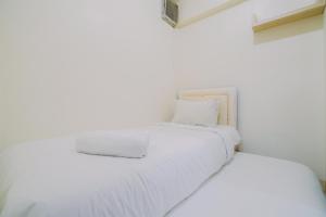 Best Price and Comfortable 2BR Green Pramuka City Apartment By Travelio