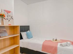 Brand New and Homey 2BR Apartment at Woodland Park Residence By Travelio