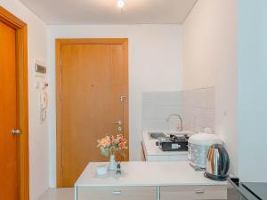 Brand New and Homey 2BR Apartment at Woodland Park Residence By Travelio