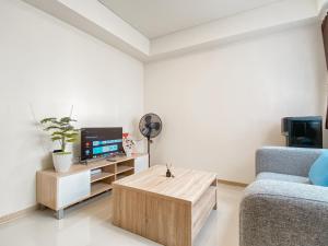 Homey and Spacious 2BR at Meikarta Apartment By Travelio