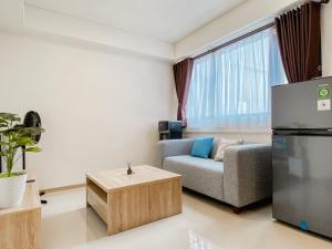 Homey and Spacious 2BR at Meikarta Apartment By Travelio