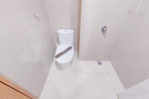 Restful and Cozy Living Studio Apartment at B Residence By Travelio