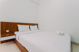 Great Location and Comfy 2BR Transpark Cibubur Apartment By Travelio