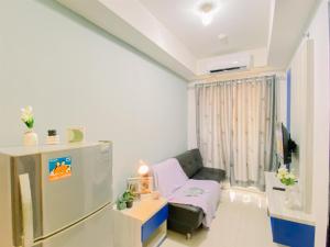 Comfort Living 1BR at Belmont Residence Puri Apartment By Travelio