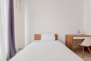 Restful and Homey Studio at Sky House Alam Sutera Apartment By Travelio