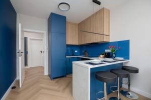 Apartament w Sercu Warszawy Biurko do Pracy Zdalnej by Noclegi Renters