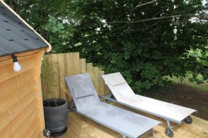 Maisons de vacances Cabane dans un jardin arbore : photos des chambres