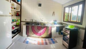 Pé na Areia Budha House