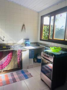 Pé na Areia Budha House