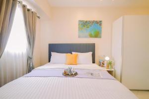 Homey and Big Studio Apartment at The Wave Kuningan By Travelio