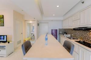 Homey and Big Studio Apartment at The Wave Kuningan By Travelio