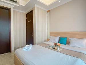 Good and Relaxing 2BR at Menteng Park Apartment By Travelio