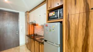 Big and Comfy Studio at Kemang Village Apartment By Travelio