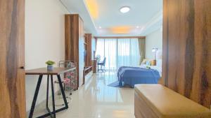 Big and Comfy Studio at Kemang Village Apartment By Travelio