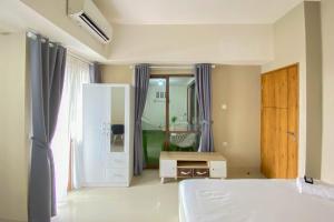 Homey and Nice 1BR at Gateway Park LRT City Bekasi Apartment By Travelio
