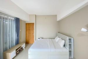 Homey and Nice 1BR at Gateway Park LRT City Bekasi Apartment By Travelio