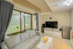 Homey and Nice 1BR at Gateway Park LRT City Bekasi Apartment By Travelio