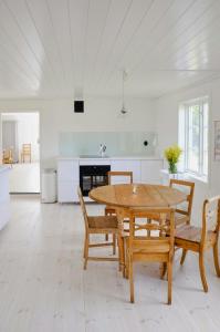 Red Wooden Cabin In Småland With Unexplored Forest