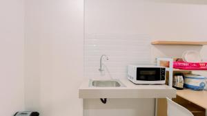 Relaxing Studio No Kitchen Apartment Bandaraya Tallasa City Makassar By Travelio