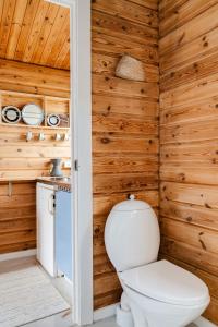 A Small Wooden Hut In A Large Community
