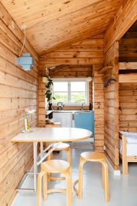 A Small Wooden Hut In A Large Community